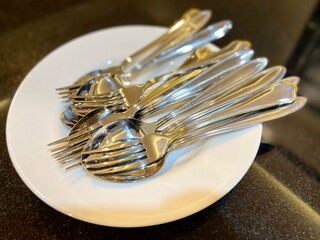 Set of cutlery on a white plate.
