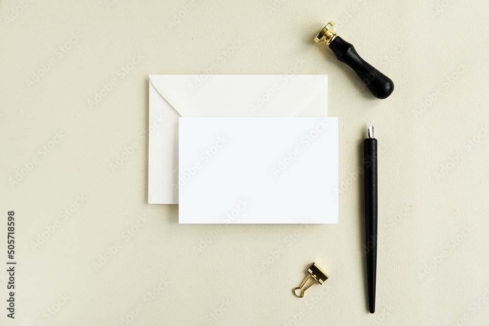 Wall mural Horizontal card mockup with white envelope, mock up for design greeting card, note card or invitation presentation, flat lay composition with calligraphy pen and wax seal.