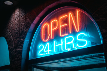 Neon Open 24 Hours Sign in Store Window - 505718965