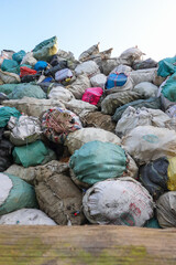 Fototapeta na wymiar Piles of plastic waste at a junkyard ready for transporting and recycling