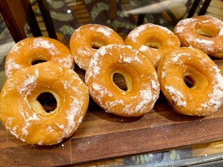 A doughnut or donut is a type of food made from leavened fried dough. Doughnuts are usually deep fried from a flour dough, but other types of batters can also be used. Various toppings and flavorings.