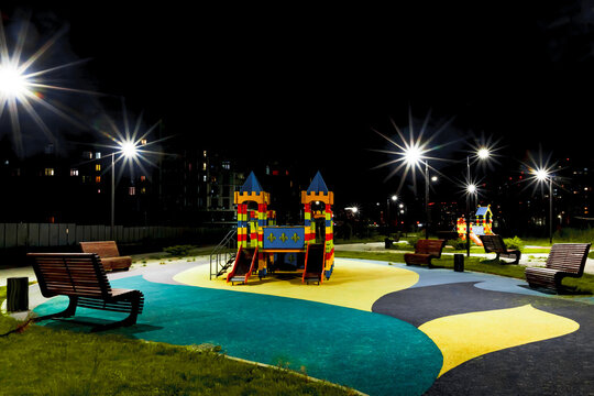 Night view playground in the yard in the light of street lights