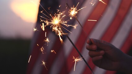 Happy 4th of July Independence Day, Hand holding Sparkler fireworks USA celebration with American...