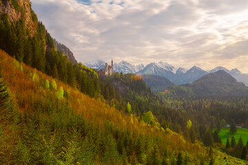 Aerial view of Neuschwanstein Castle with scenic mountain landscape near Fussen, Bavaria, Germany.