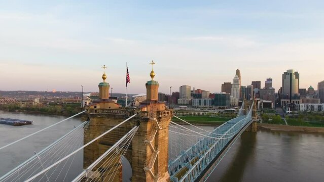 Drone shot starting on the John A. Roebling Bridge then panning to the Cincinnati Ohio skyline