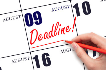 Hand drawing red line and writing the text Deadline on calendar date August 9. Deadline word...