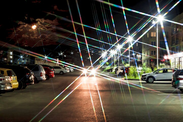 Fototapeta na wymiar The night highway is an empty city street with bright lights
