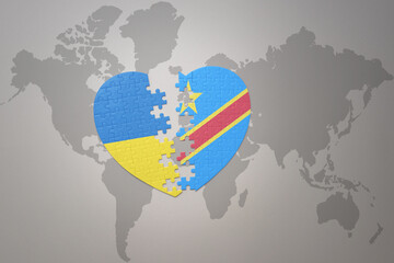 puzzle heart with the national flag of ukraine and democratic republic of the congo on a world map background. Concept.