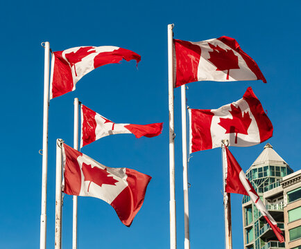 Waving flags of Canada. Canada flag isolated on sky background. close up waving flag of Canada. flag symbols of Canada.