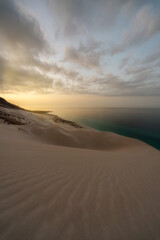Fototapeta na wymiar Sand dunes at Arher beach at the eastern tip of Socotra, Yemen, taken in November 2021