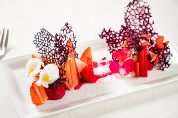 strawberry dessert wit edible flowers