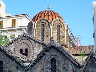 Fototapeta na wymiar Roof and dome of the Byzantine church of Panagia Kapnikarea on Ermou Street in Athens, Greece