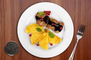 Roast barbecue sliced on white plate. Beef veal steak with vegetable on a plate. Top view.