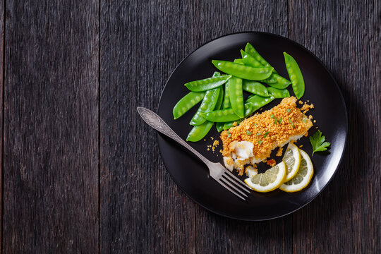 Baked Haddock with Crackers toppings and snow peas