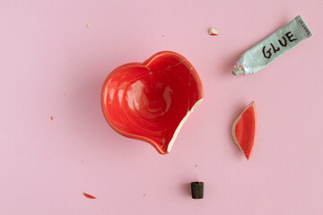 Repairing a Broken Heart Bowl on Pink Background
