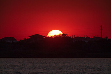 The sun goes down over a lake