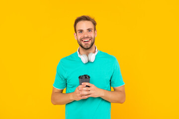 happy man in modern earphones with coffee cup. online education. back to school.