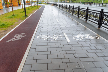 City park pavement markings bike path, treadmill on asphalt, red carpet for jogging, place for...