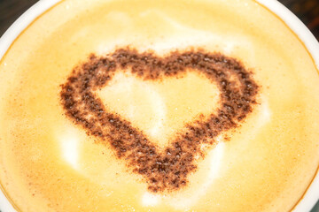 Delicious coffee with a heart in the middle. Close-up of a coffee drink
