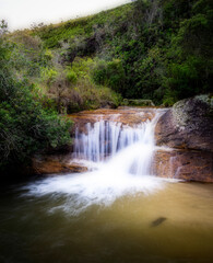 Obraz premium Waterfall in the Mountains