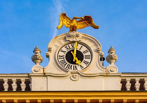 Clock on roof of Schonbrunn palace in Vienna, Austria