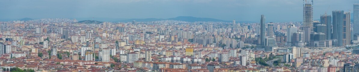 Fototapeta premium Turkey, Istanbul, Panoramic aerial view of a wide populated area on the Anatolian side of the city, roofs and skyscrappers photo