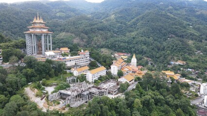 Fototapeta na wymiar Georgetown, Penang Malaysia - May 17, 2022: The Kek Lok Si Temple. A hilltop temple characterized by colorful, intricate decor and many Buddha statues.