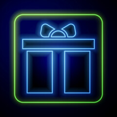 Glowing neon Gift box icon isolated on blue background. Happy Birthday. Vector