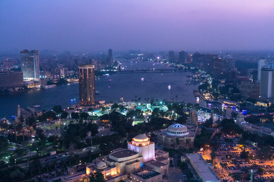 Egypt, Cairo, Aerial view of cityscape and Nile river at night © Image Source