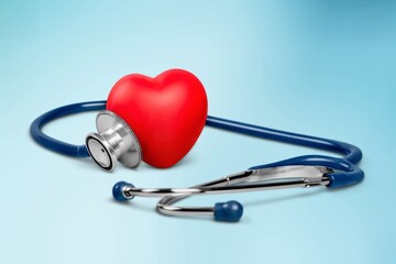 Red heart with medical stethoscope, heart health, health insurance concept, World heart day.