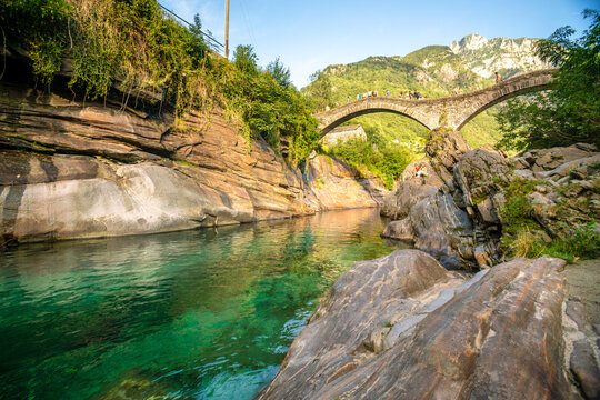 Switzerland, Ticino, Stone bridge over mountain river