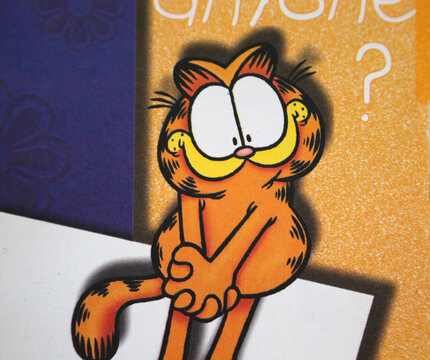 Garfield. Lasagna loving orange cat. Character of television series, comics and movies. Isolated. Personal agenda. Notebook. Annotator. Jim Davis character.