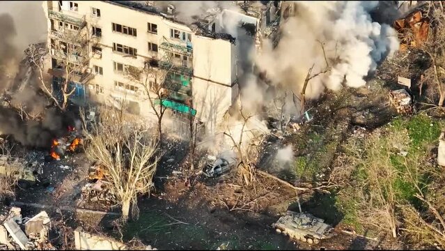 Russian tank destroys civilian building. Tank blows up the house. Mariupol, Ukraine war.