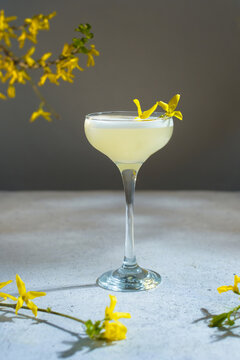 Glass Of Pisco Sour Cocktail Decorated Yellow Flowers.