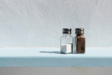 Salt and pepper aginst white background