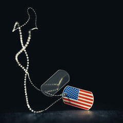 Falling US military soldier's dog tags in the shape of the American flag with chain. Memorial Day or Veterans Day concept. - 505795702