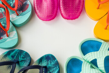 Plastic sea shoes and beach slippers designed around the message space
