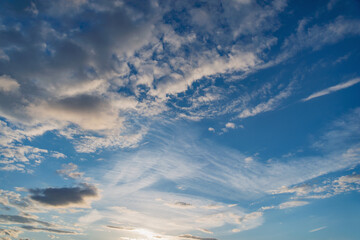 Naklejka na ściany i meble Amazing cloudscape on the sky at sunset time.