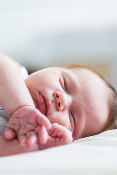Sleeping newborn baby hands detail