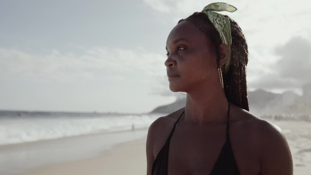 Latin young girl, famous beach Rio de Janeiro, Brazil. Latin summer vacation holiday. Cinematic 4K.