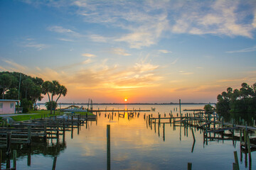 Sunrise on the Indian River at an old marina with wooden piers in Mebourne, Florida. 