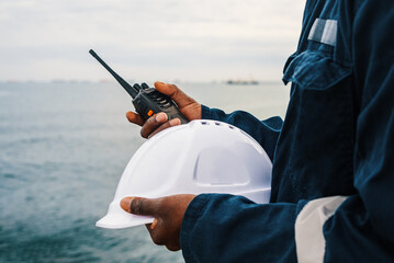 Crop seaman with hardhat and radio