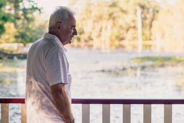 senior man at lookout over a lake