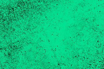 Abstract dark grunge texture on green background