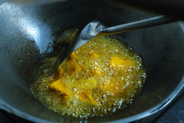 The process of frying traditional food tofu in a wok