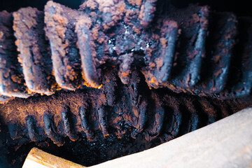 Tar and soot in the furnace of a solid fuel boiler after the heating season close-up