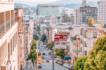 San Francisco, California, USA - October 16, 2021, descending row of stately homes on a hill, a...