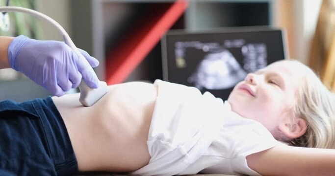 Doctor conducting ultrasound examination of internal organs of child in clinic 4k movie