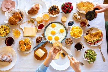 Cheesecakes on a white table. Cheesecakes with berries and honey. Beautiful breakfast. Food day. Dinner. Buffet. Breakfast on the table top view.Food on the table top view.Muesli with berries. Fried 