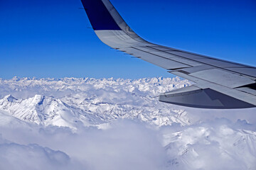 View of the high mountain on the window of air plane